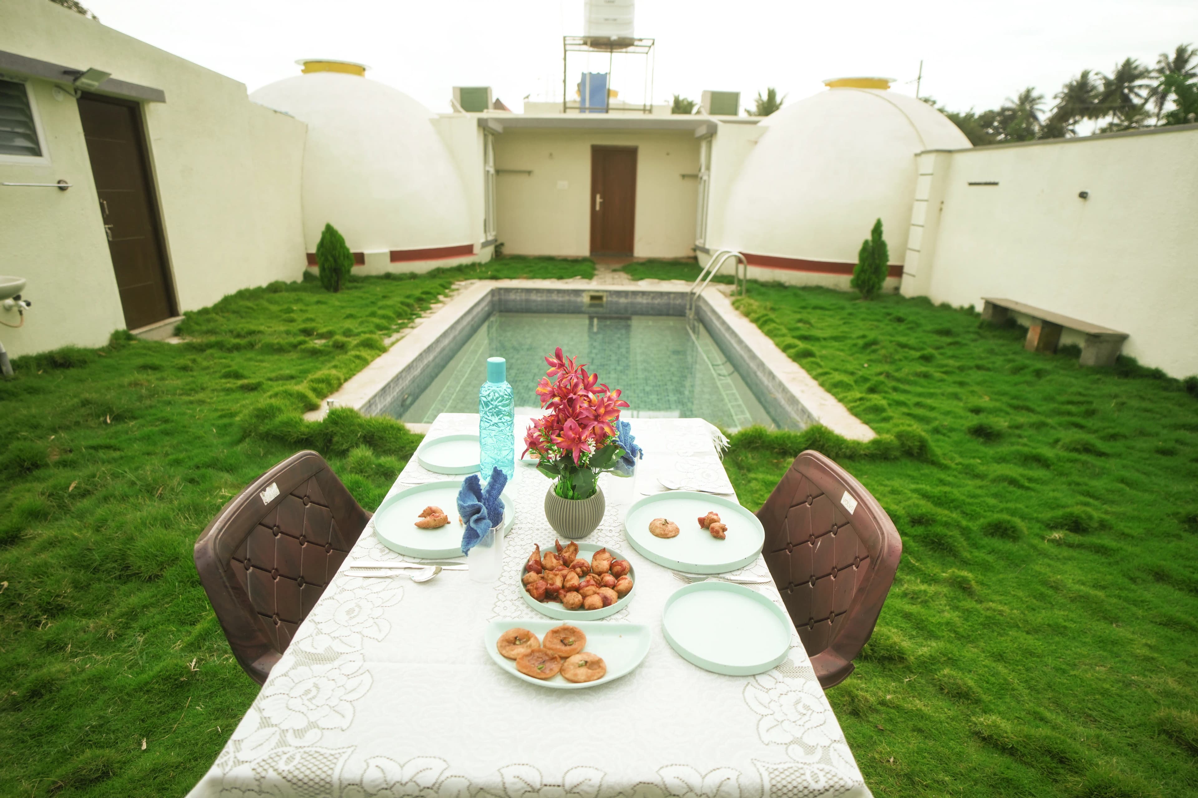 A meal set beside the private pool at Q Farm