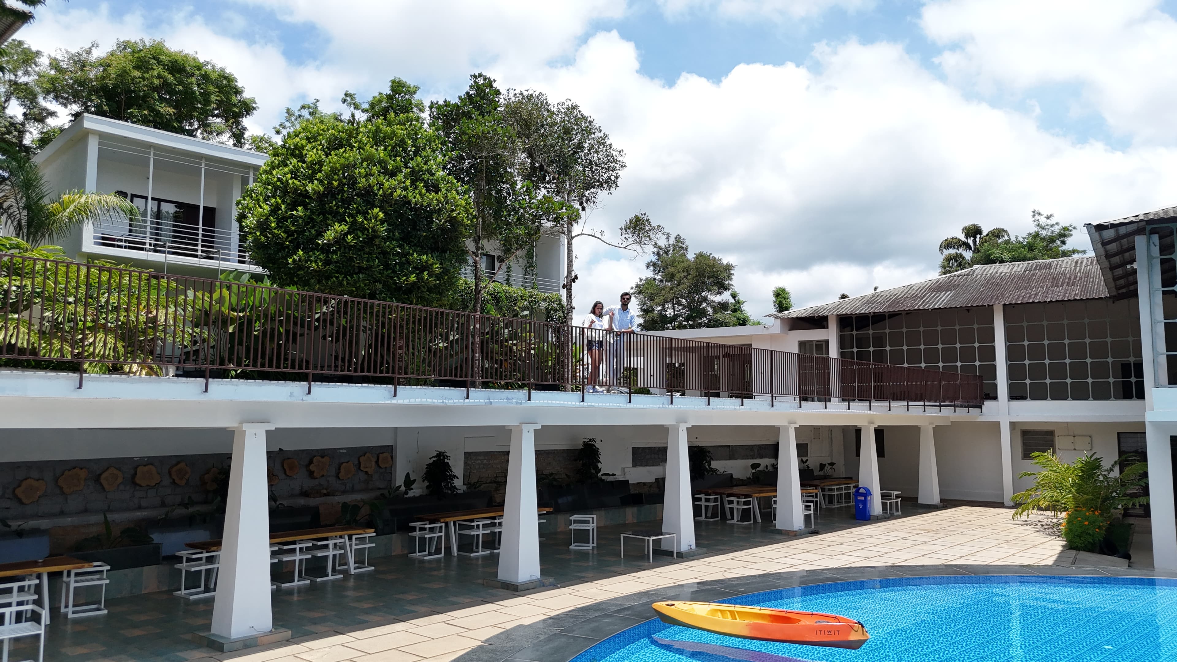 Pool and white building at the Q Lionton coffee estate